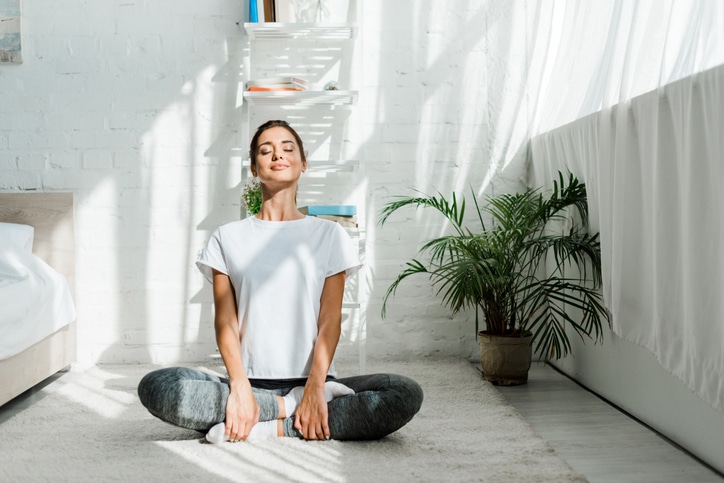 adult woman meditating in the morning
