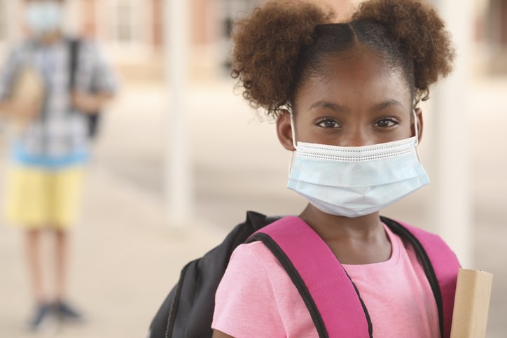 child going back to school during pandemic