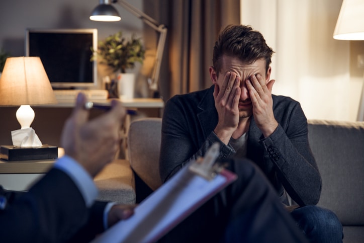 man talking to his therapist about suicide