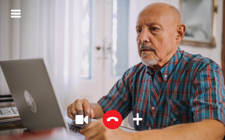 older man on online psychiatry appointment