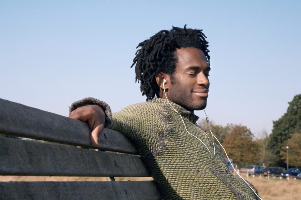 Man on bench smiling