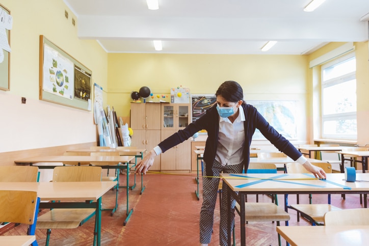 teacher taking safety procautions in her classroom