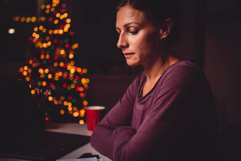 woman appears sad during holidays